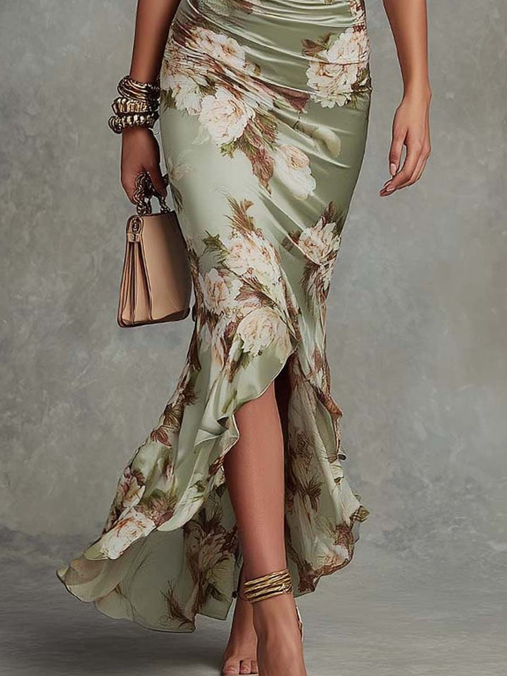 Anna | Asymmetrical long satin dress in green with V-neck, bell sleeves, and floral pattern